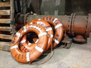 Extra ferry life rings lean against other spare parts at the Ketchikan Marine Engineering Facility at Ward Cove last January. (Ed Schoenfeld/CoastAlaska News)