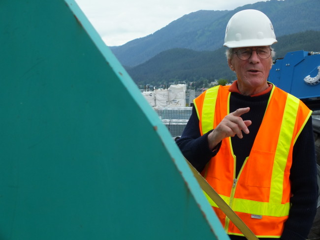 Canadian sculptor Robert Murray created Nimbus in 1977.  In the background are the hills of Douglas Island, part of the local terrain that he says inspired him during creation of the sculpture. (Photo by Matt Miller/KTOO)