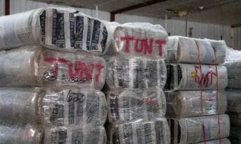 Bundles of insulation are staged in a warehouse and marked for delivery to Tuntutuliak, one of the villages impacted by ex-typhoon Halong, in Bethel on Nov. 7, 2025.
